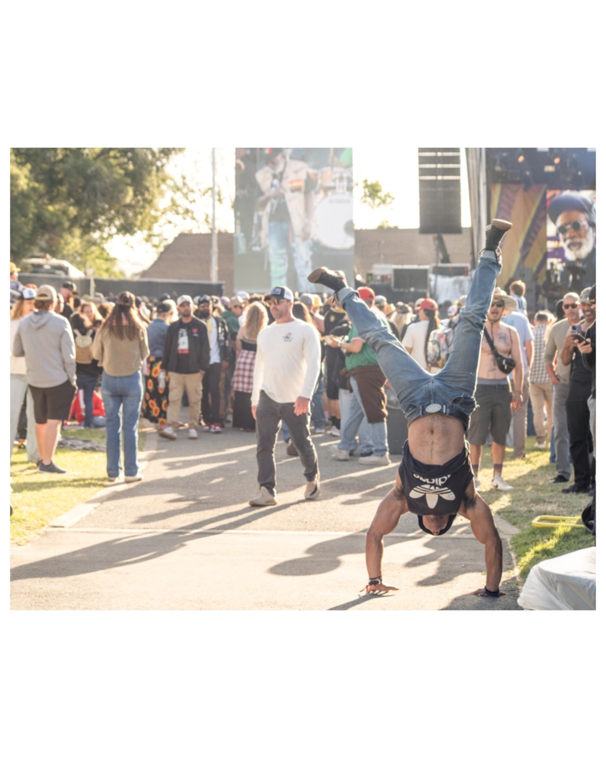 Festival attendee performing an acrobatic move