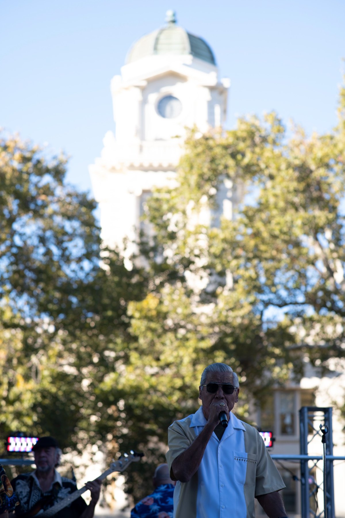 Ruben Ramos performing beneath downtown Sacramento architecture
