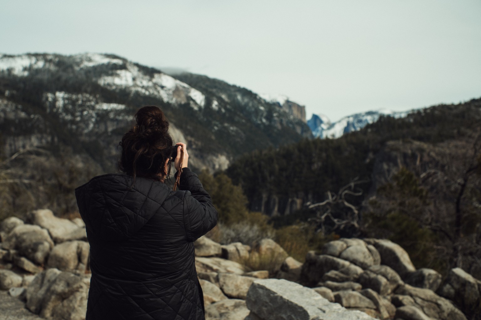 Photographer overlooking a mountain valley